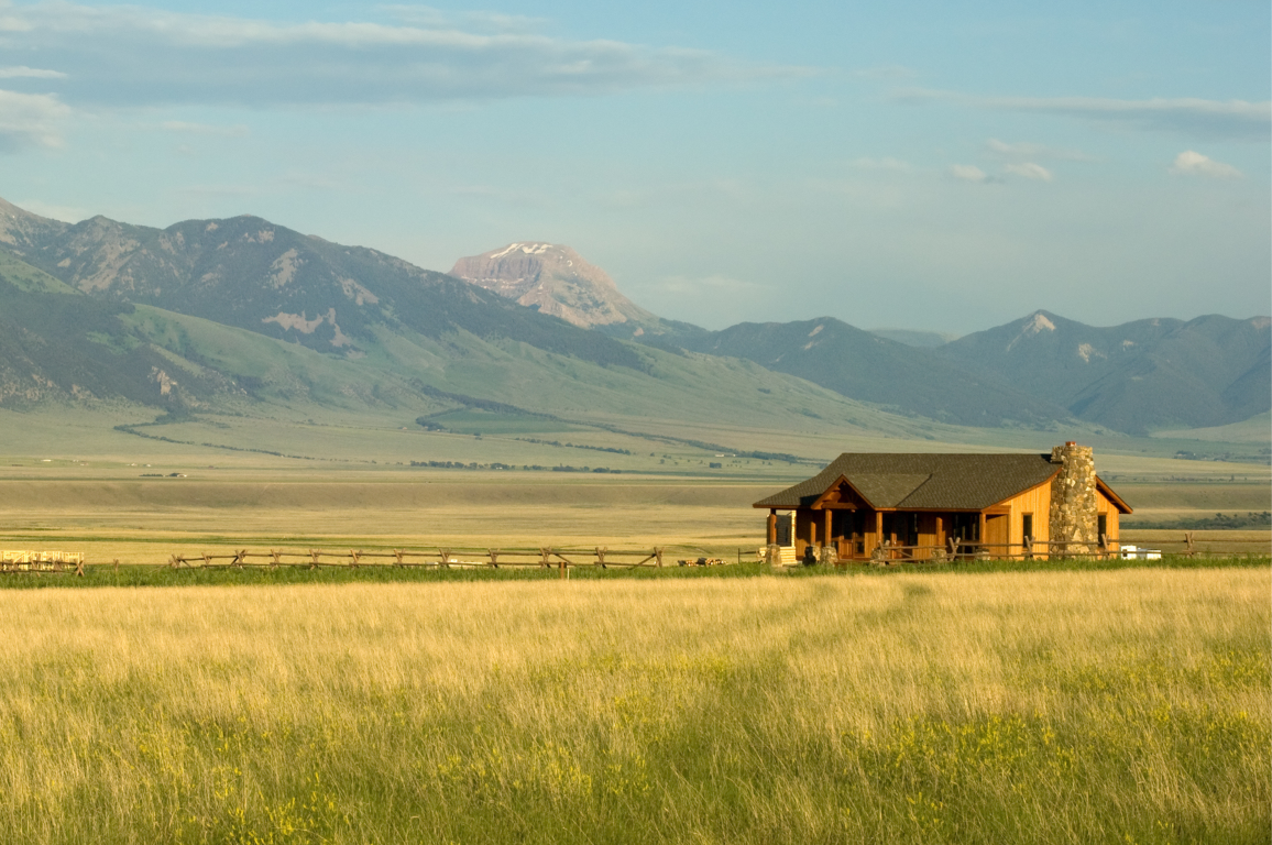 Ranch house with mountains on background in Montana, USA